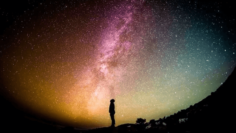 Person looking up to night sky